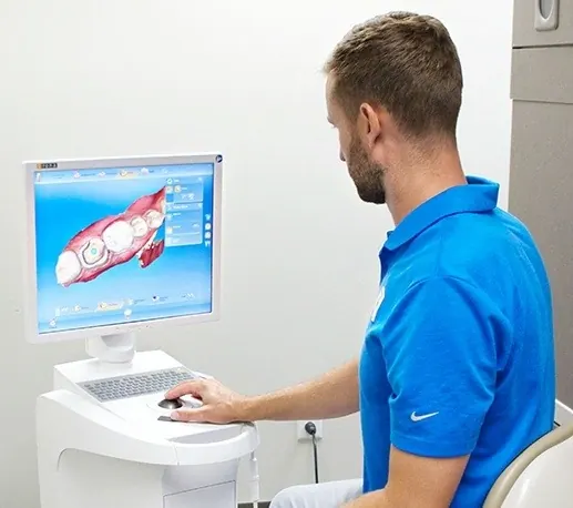 Dr. Hickey designing a restoration on the CEREC system at Granger Dental Group.